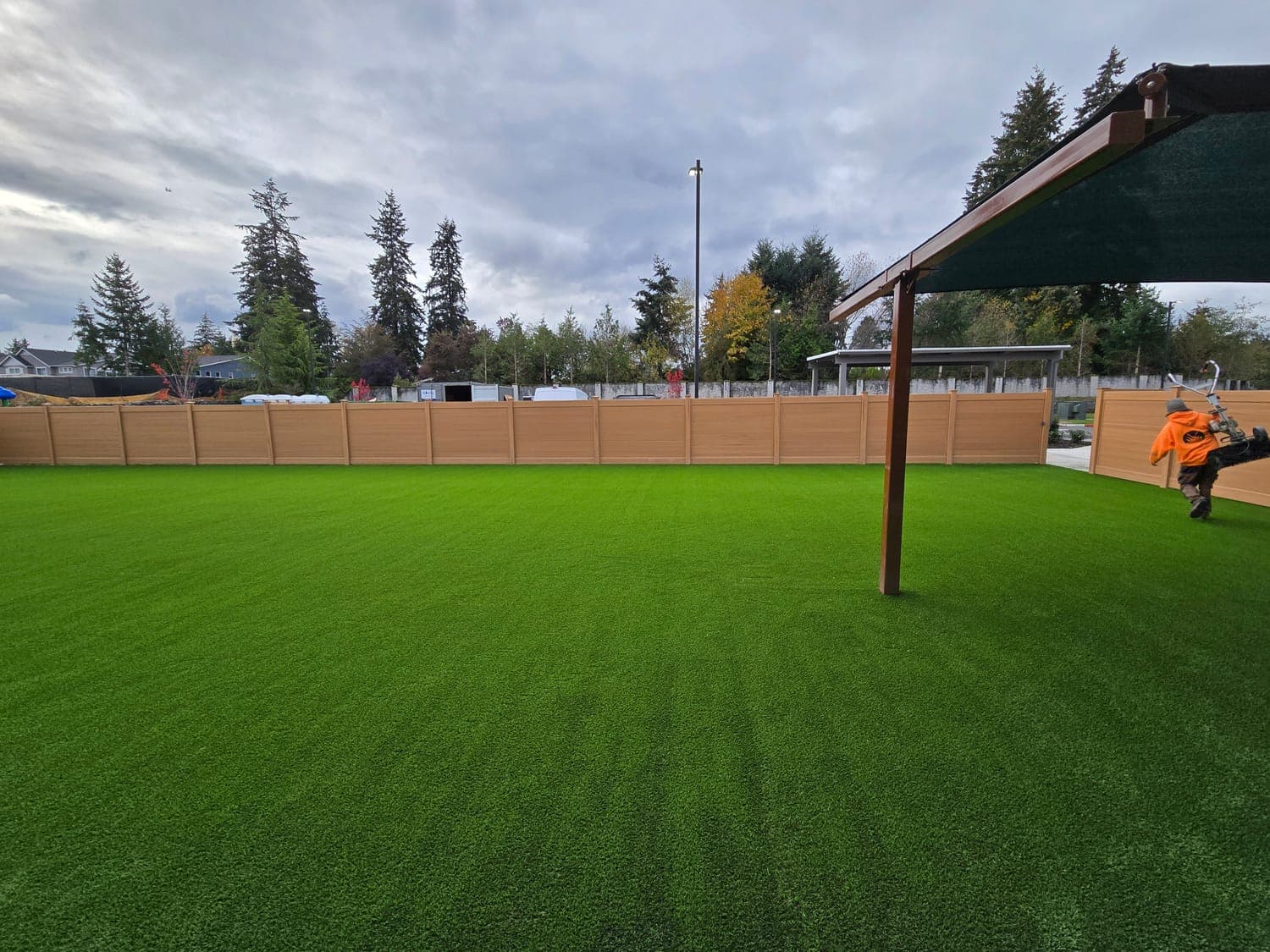 Large fenced artificial turf play field for a commercial or multi-family property